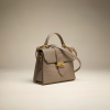 structured taupe leather top-handle handbag with gold hardware
