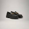 black chunky lug-sole leather loafers with gold horsebit
