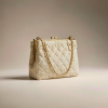 ivory quilted lambskin shoulder bag with a gold chain strap