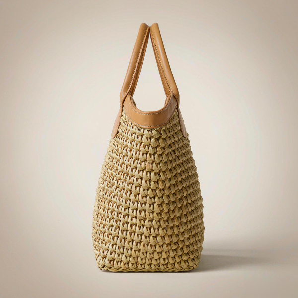 natural hand-woven raffia tote bag with tan leather handles